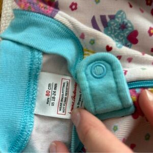 Colorful Baby Onesie with Heart and Flower Design